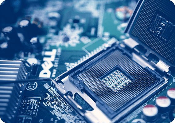 Engineer examining microchip through magnifying glass